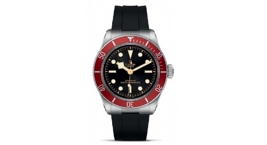 a silver and red watch with a black dial and strap by TUDOR