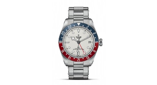 a stainless steel watch with a white dial and blue and red bezel